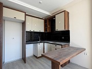 Квартира 1+1 в новом жилом комплексе у моря в Мерсине За границей