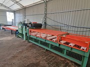 Многопильная линия для раскроя с центрирующим столом и выгрузкой досок Алматы