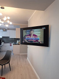 Установка телевизоров на стену при помощи кронштейнов Алматы