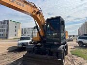 Аренда экскаватор колесный с гидромолотом Астана