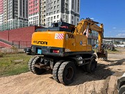 Аренда экскаватор колесный с гидромолотом Астана